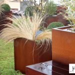 Toiture terrasse à Anderlecht. Des bacs d’acier Corten et une terrasse en Ipé